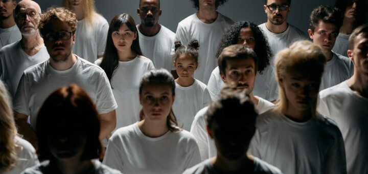 photo of people wearing white crew neck shirt