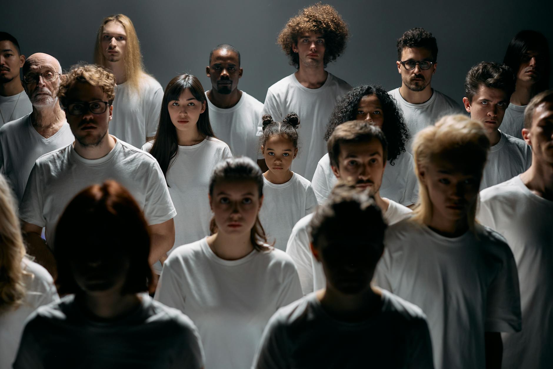 photo of people wearing white crew neck shirt